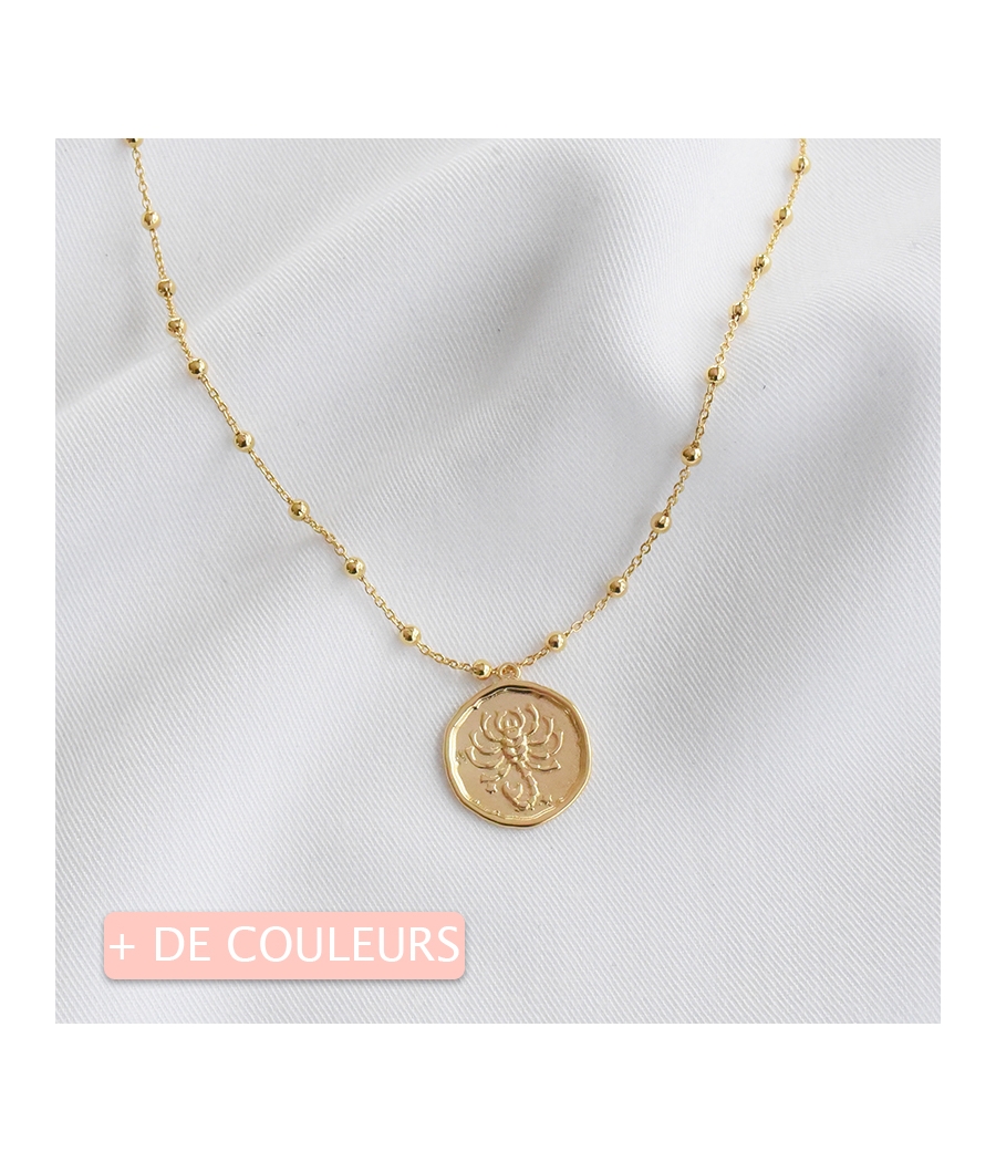 Collier chaine perlée et médaille astro